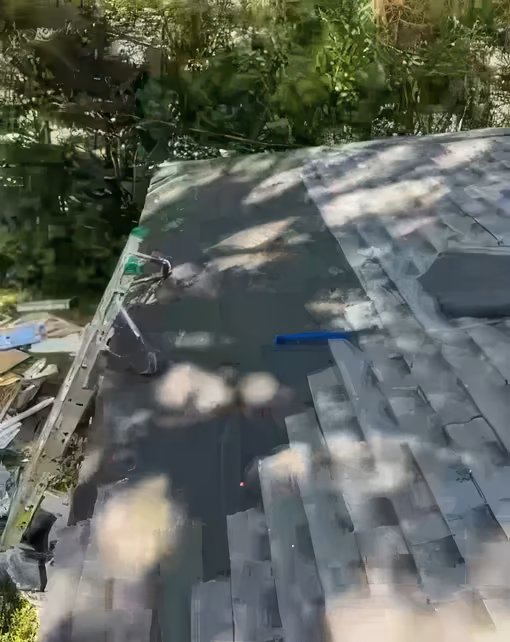 New underlayment and shingles going on a roof